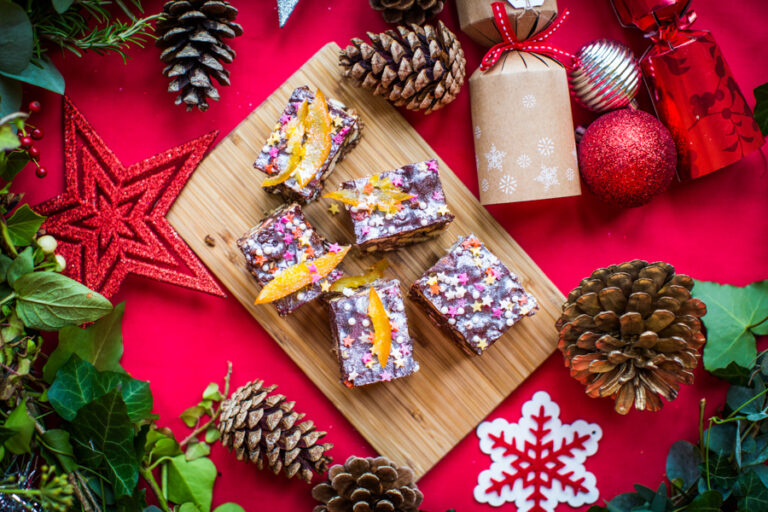 Christmas background with delicious rocky road cakes decorated with stars and snow