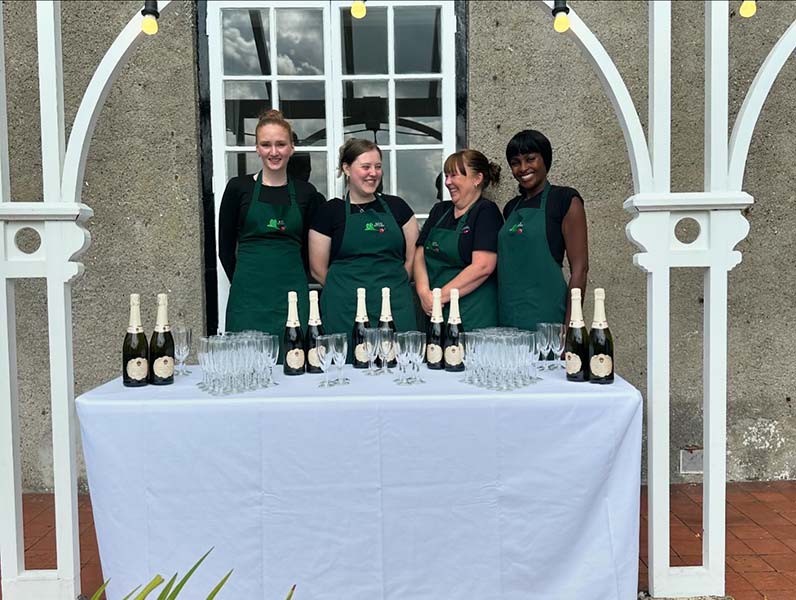 service staff at wedding reception by kate’s kitchen catering in bristol service staff at wedding reception by kate's kitchen catering in bristol