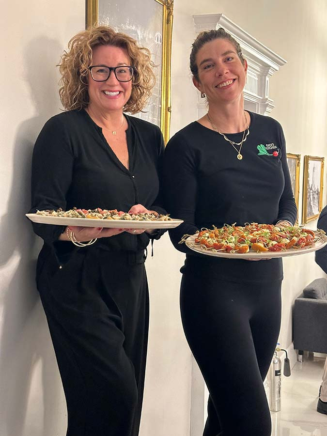 kate and emma serving finger food canapes at event in bristol