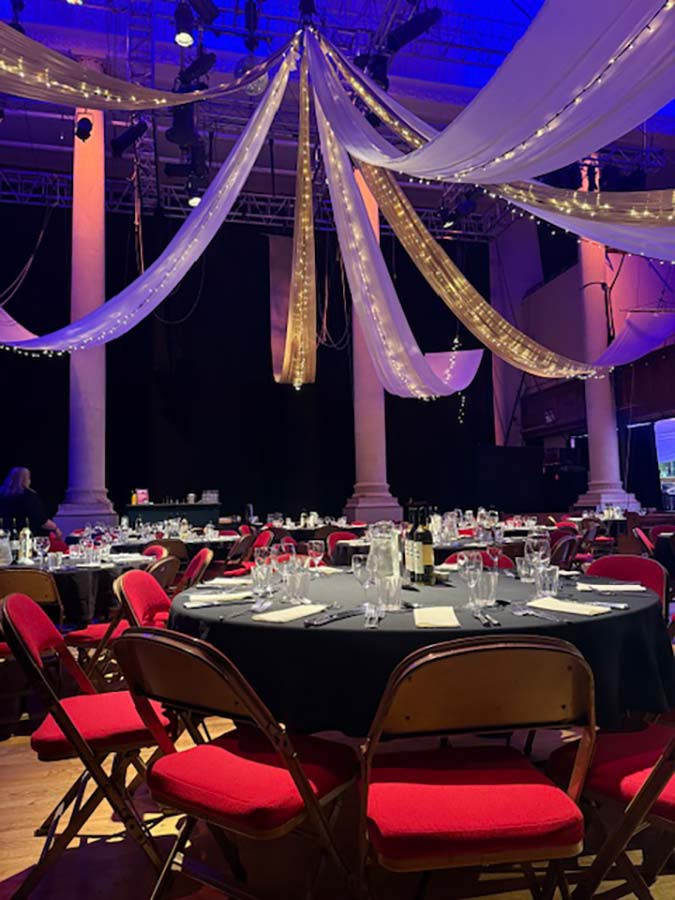 circomedia dressed with ceiling drapes and lighting for wedding party